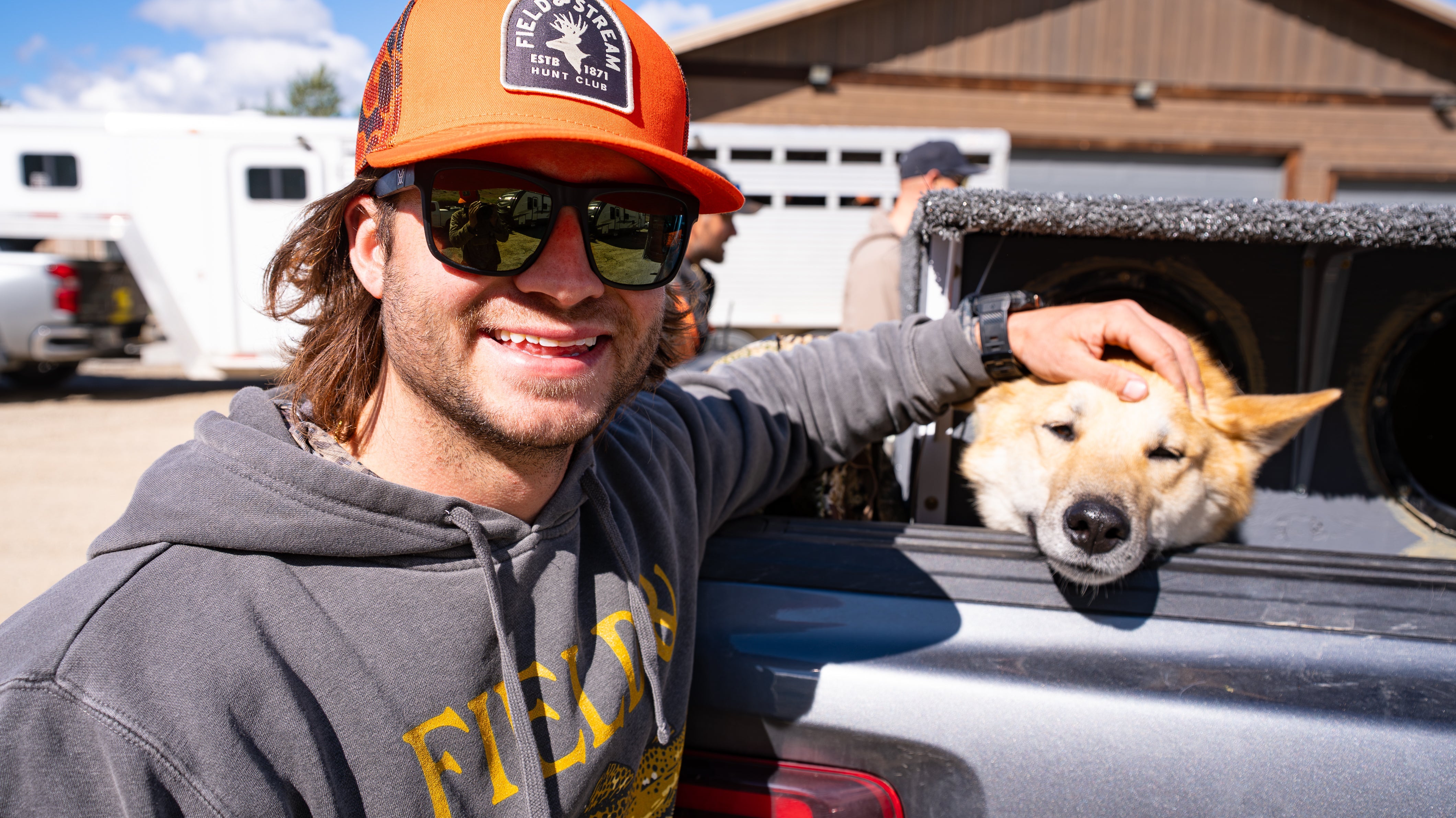 Hunter wearing the MEATDOG duck camo hoodie outdoors