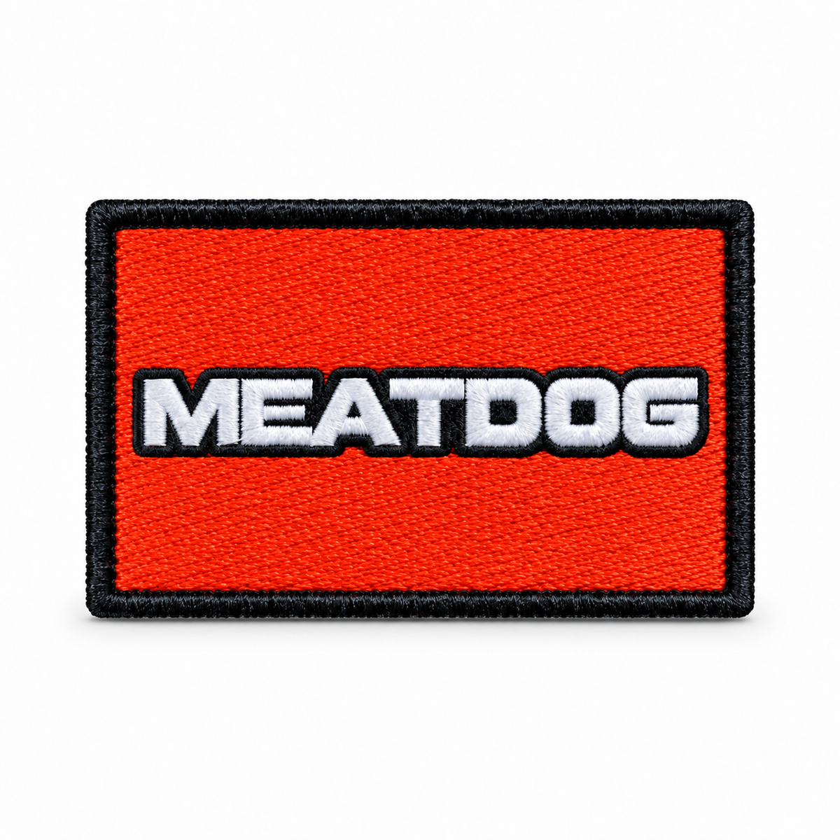 Blaze Orange rectangular MEATDOG embroidered patch with a white wordmark and black stitched border